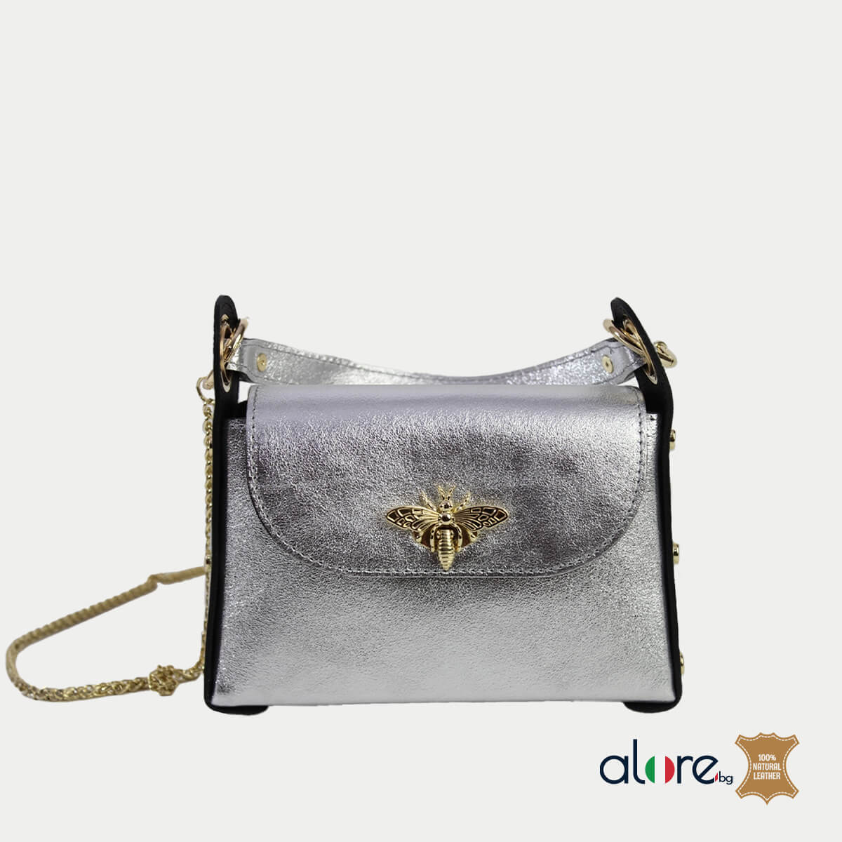 Малка дамска чанта от естествена кожа Miranda сребро. Затваряне с капак и закопчалка и метална дълга дръжка.